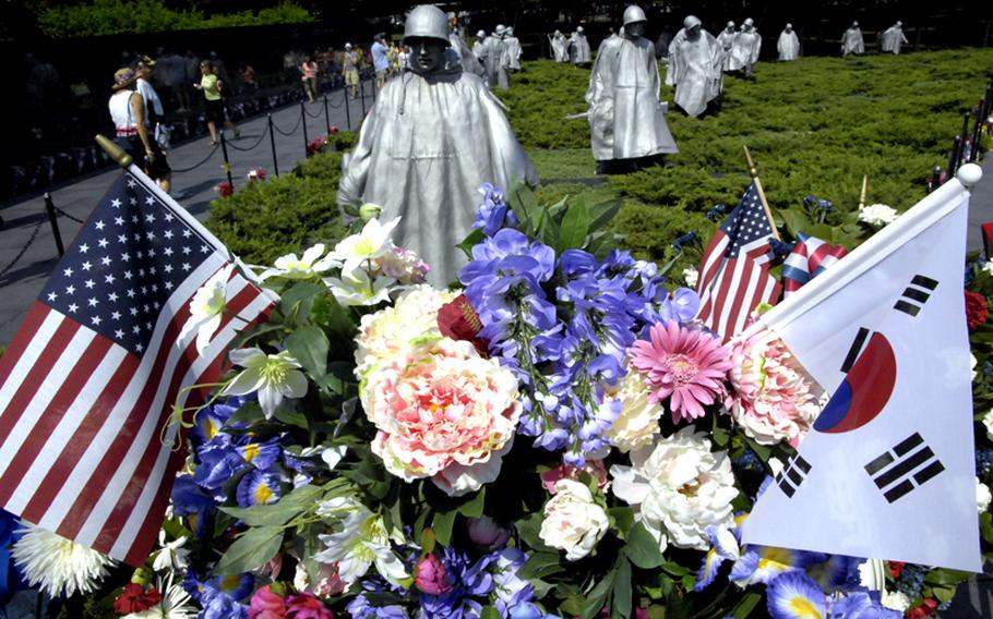 American and South Korean flags are featured in a florak display places at the Korean War Memorial on Monday.