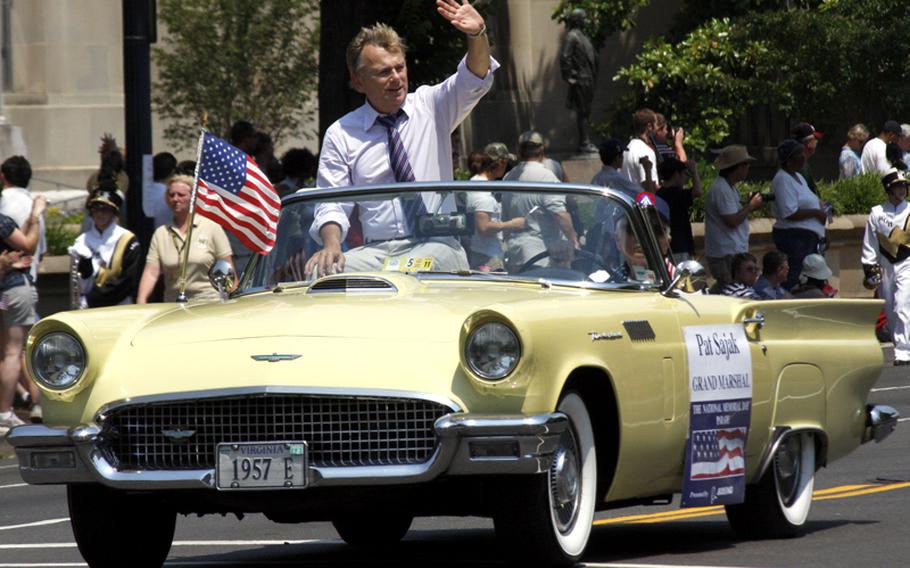Memorial Day parade grand marshal Pat Sajak waves to the crowd.