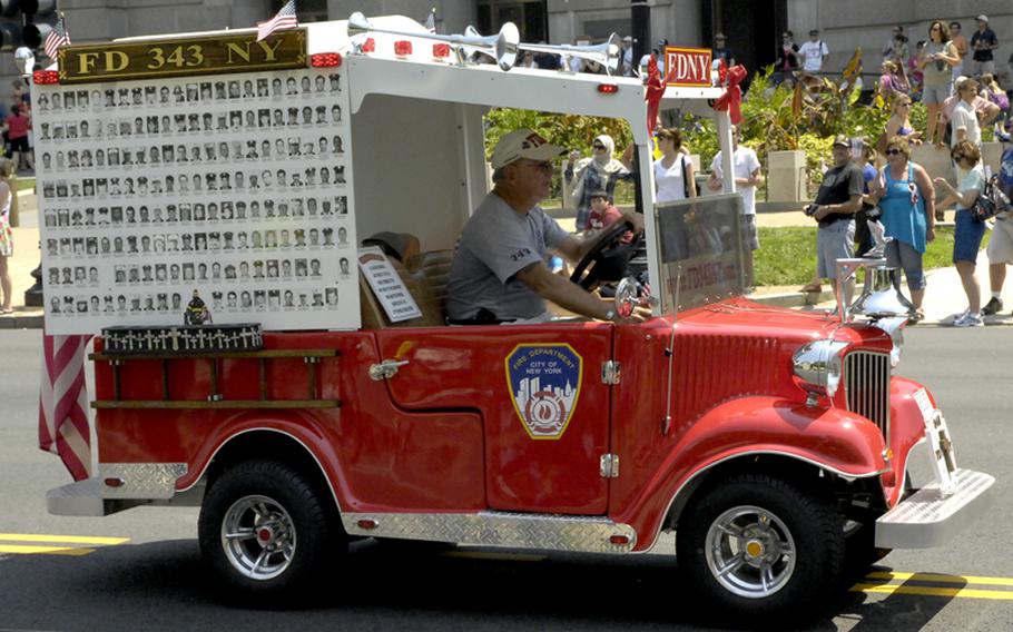 A vehicle in the Memorial Day parade honors New York firefighters killed in the 9/11 attacks.
