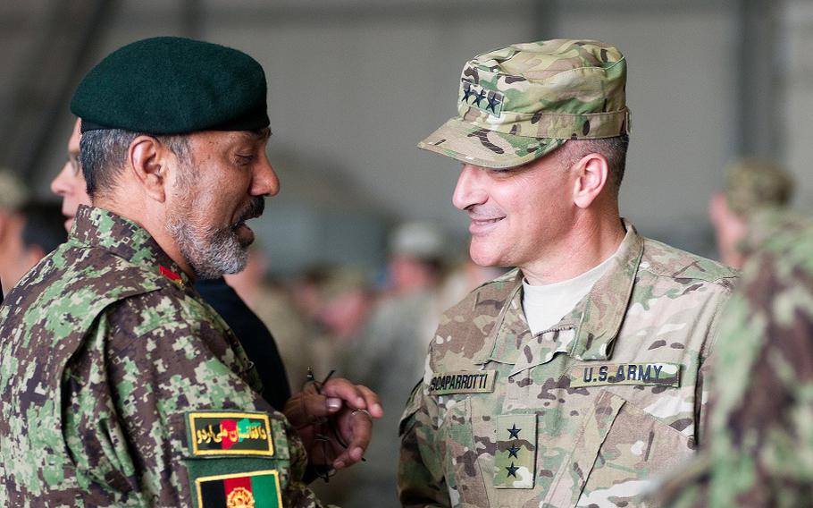 In this file photo from 2011, Lt. Gen. Curtis Scaparrotti speaks with an Afghan National Army officer after the ISAF Joint Command change of command ceremony in Kabul. Scaparrotti replaced Lt. Gen. David Rodriguez as IJC commander.