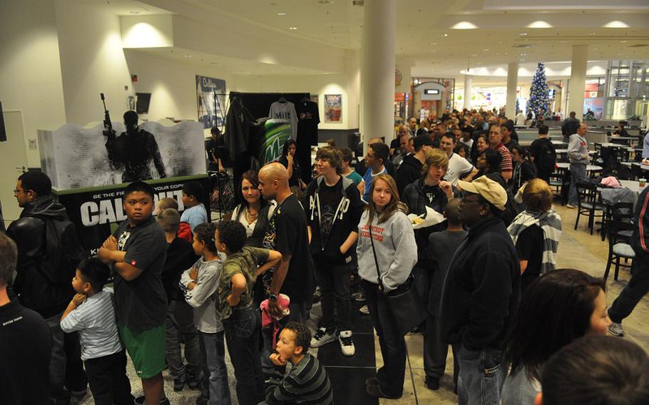 Crowds gathered to play the "Call of Duty: Modern Warfare 3" demo less than four hours before the game's midnight release at the Ramstein Air Base, Germany, PowerZone.