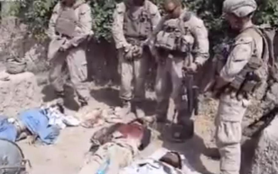 The Marine Corps launched an investigation after a video posted on YouTube showed several Marines laughing and appearing to urinate on the bodies of dead insurgents.