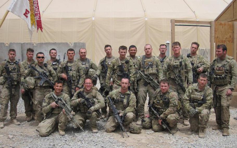 Team 3 Pathfinders with 4th Battalion, 101st Aviation Regiment, 159th Combat Aviation Brigade, 101st Airborne Division pose for a photograph on April 15, 2011 on Mustang Ramp at Kandahar Airfield, Afghanistan. They are, back row, from left, Staff Sgt. Edward Mills, Spc. Lucas Blignaut, Sgt. Richard Gilman, Sgt. Charles Bryant, Spc. Anthony Marcketti, Spc. Myles Lougee, Spc. James Roberts, Sgt. Brian Evans, Sgt. Louis Ramos, Spc. Blakelyn Evans, Sgt. Kristofor White, Staff Sgt. Joe Kinsley, Sgt. Thomas Bohall, Staff Sgt. Ergin Osman. Front row, from left, Sgt. Jon McMillen, Sgt. Brock Whisler, Spc. Adam Patton, Capt. Tom Buller, 1st Lt. John Runkle.