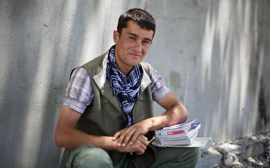 Zubai, 15, makes a living selling various items to coalition military personnel, mostly books and maps. He also fills special requests for hats, clothing, shoes and other items hard to find on coalition bases.