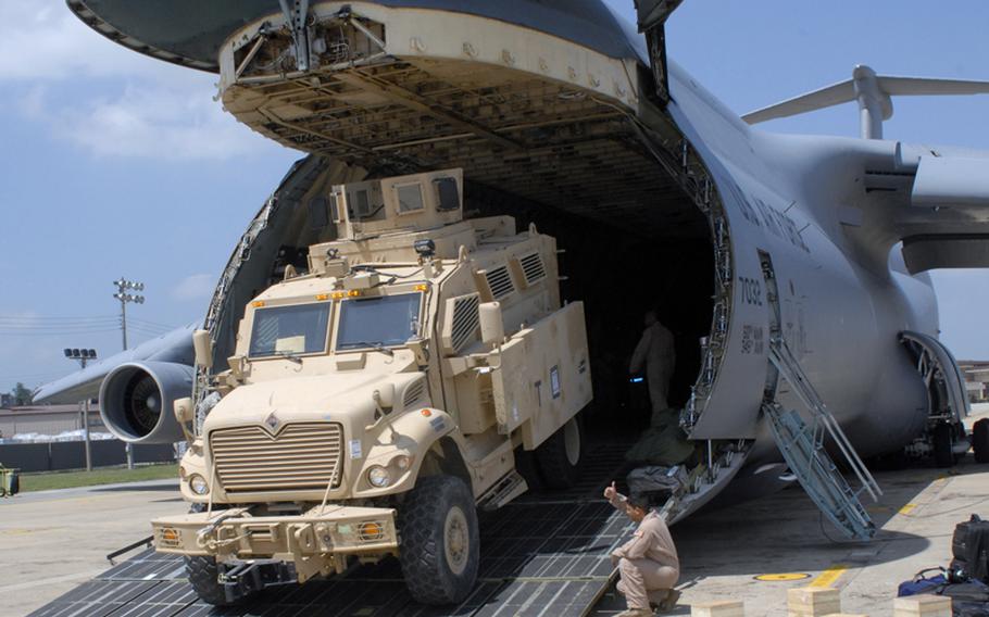 A Mine Resistant Ambush Protected vehicle rolls off a C-5 Galaxy at Osan Air Base, South Korea, on July 7, 2012. Five MRAPs were flown to Osan then delivered to the 2nd Infantry Division, which will test the vehicles to see how they might be used by American troops on the Korean peninsula.