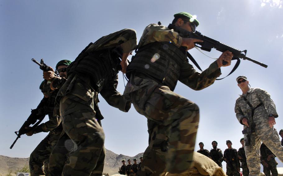 A U.S. servicemember trains Afghan troops at a training camp in Kabul, Afghanistan, in June 2007. On Wednesday, April 8, 2015, an Afghan soldier opened fire on coalition troops killing a U.S. servicemember and wounding at least two others.