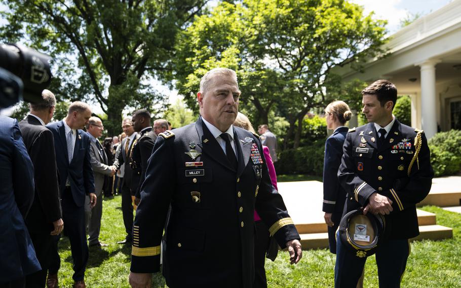 Gen. Mark Milley, chairman of the Joint Chiefs of Staff pictured above at a May 2019 event at the White House, bears "scars" from the Trump era, but his survival in the Biden administration speaks to his and the military's nonpartisan ethos. 