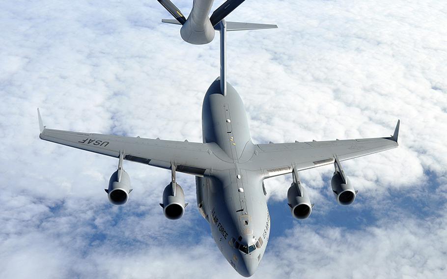 A KC-135 Stratotanker prepares to refuel a C-17 over the Atlantic Ocean, on Oct. 29, 2011.

