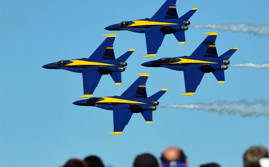 F/A-18C Hornets assigned to the U.S. Navy flight demonstration squadron, the Blue Angels, fly in formation over Jacksonville, Fla., during the 2012 Sea and Sky Spectacular.