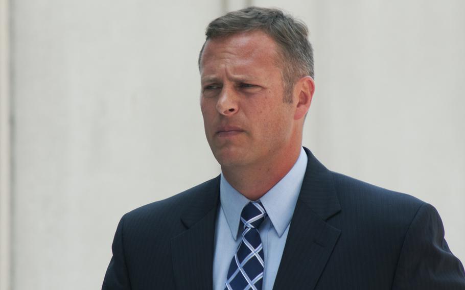 Lt. Col. Jeffrey Krusinski, formerly the Air Force's point man on sexual assault prevention programs, arrives at the Arlington County courthouse on July 18, 2013. Krusinski was originally charged with sexual battery stemming from a May incident in Arlington, Va, but is now being charged with assault and battery.