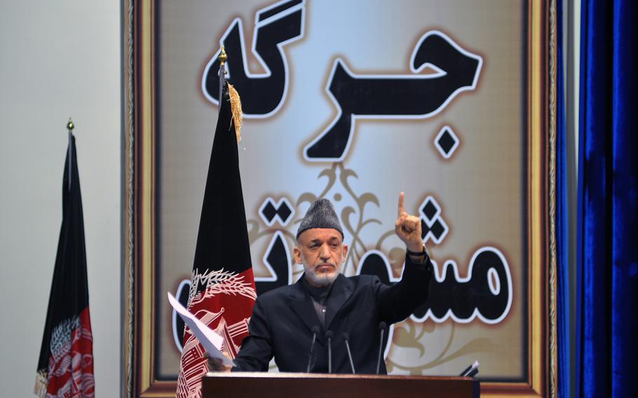 Afghan President Hamid Karzai addressed the Loya Jirga, a gathering of Afghan leaders, on Nov. 24, 2013, when the group endorsed a proposed security agreement with the U.S. to keep a military training and assistance force in Afghanistan past the end of 2014. 