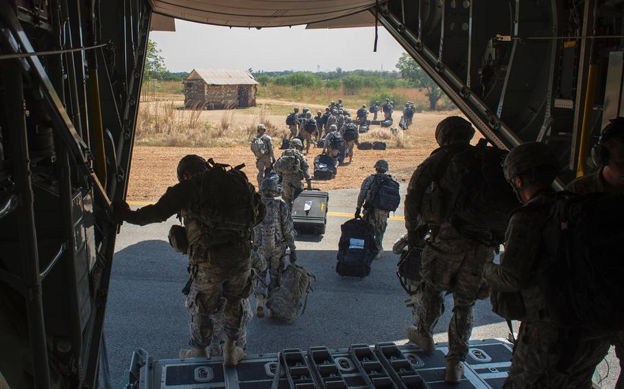 U.S. troops with Combined Joint Task Force-Horn of Africa's East Africa Response Force depart an U.S. Air Force C-130 Hercules from Camp Lemonnier, Djibouti, on Dec. 18, 2013. The EARF deployed to South Sudan supporting the ordered departure of the U.S. Embassy. 