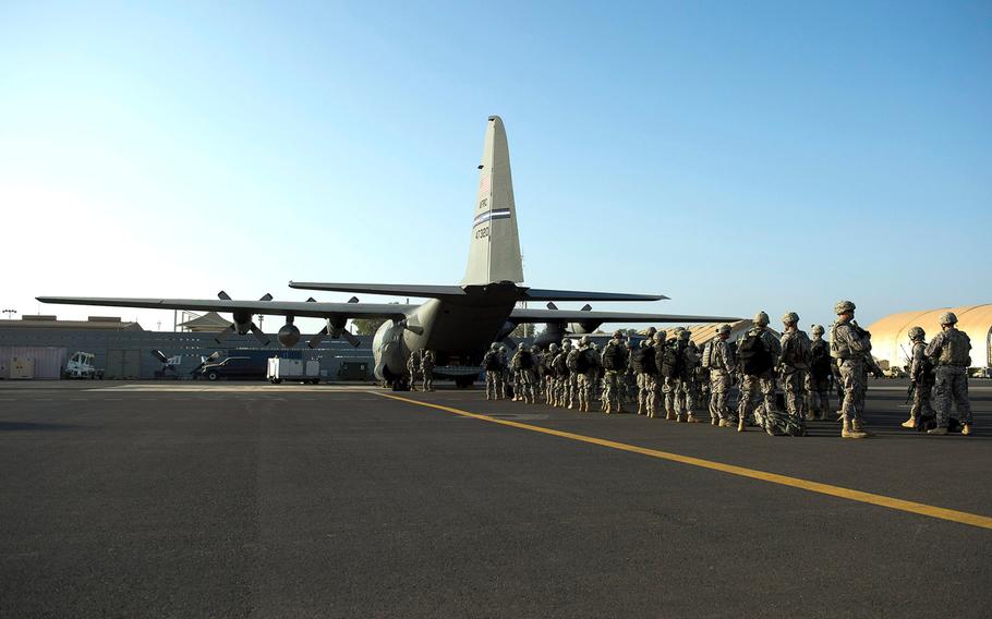 U.S. troops with Combined Joint Task Force-Horn of Africa's East Africa Response Force load onto a C-130 Hercules at Camp Lemonnier, Djibouti, on Dec. 18, 2013. The EARF deployed to South Sudan supporting the ordered departure of the U.S. Embassy.