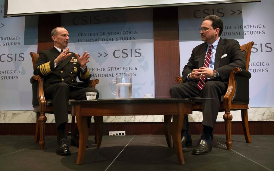 In this file photo from May 19, 2014, Chief of Naval Operations Adm. Jonathan Greenert speaks with Mike Green, vice president of Asia and Japan studies at the Center for Strategic and International Studies, about the Navy's rebalance to the Asia-Pacific region during a conference in Washington, D.C.