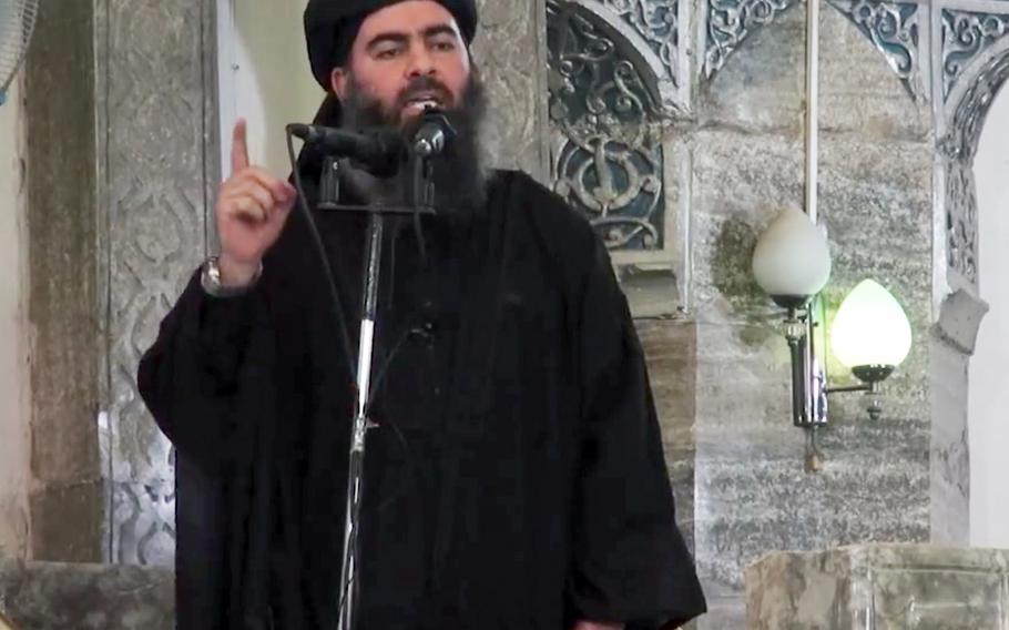 This image made from video posted on a militant website Saturday, July 5, 2014, which has been authenticated based on its contents and other AP reporting, purports to show the leader of the Islamic State group, Abu Bakr al-Baghdadi, delivering a sermon at a mosque in Iraq.