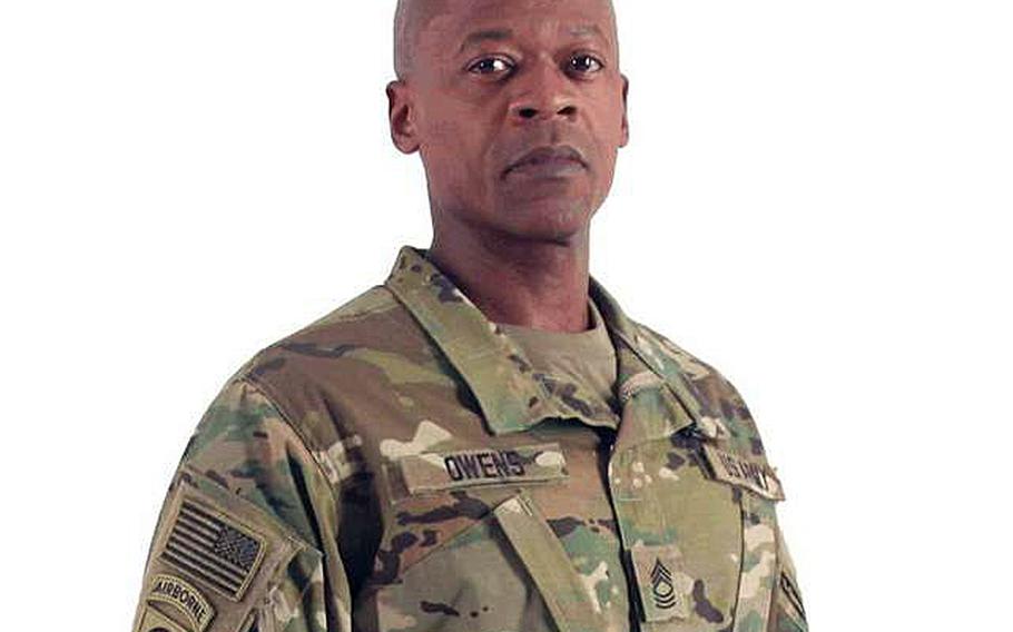 A soldier shows off the Army's new camouflage uniform.