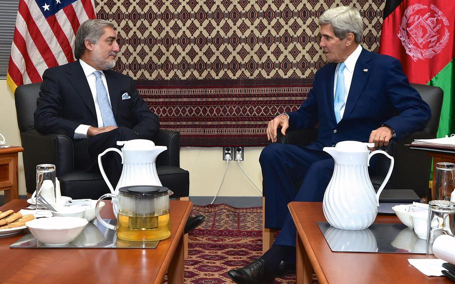 U.S. Secretary of State John Kerry sits with Afghan presidential candidate Abdullah Abdullah in Kabul on August 7, 2014, before a meeting about the ongoing recount of the presidential election vote between Abdullah and rival candidate Ashraf Ghani.