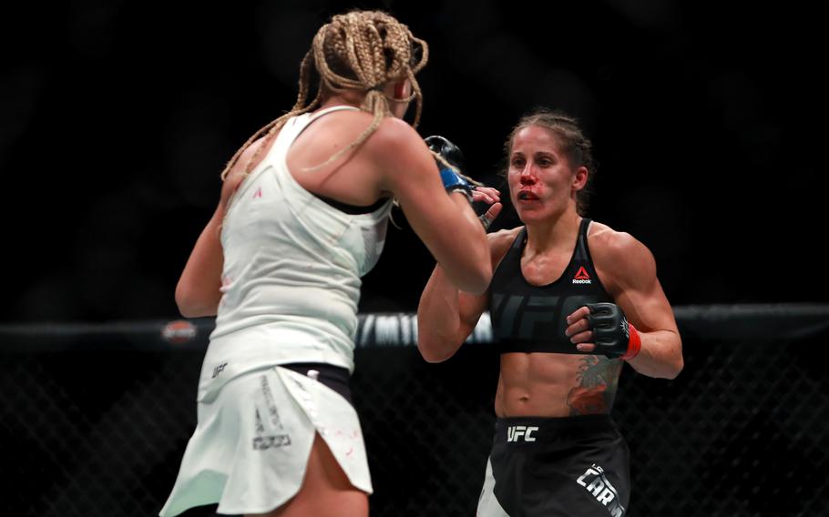 Liz Carmouche of the United States, right, fights against Katlyn Chookagian of the United States in their women's bantamweight bout during the UFC 205 event at Madison Square Garden on Nov. 12, 2016 in New York City. 