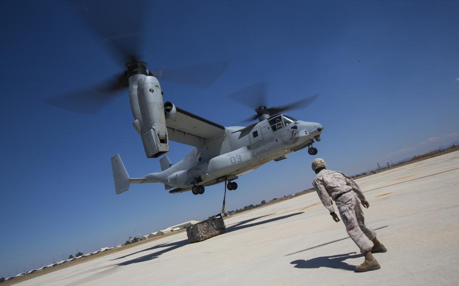 An MV-22 Osprey with Special-Purpose Marine Air-Ground Task Force Crisis Response picks up cargo during helicopter support team training at Morón Air Base, Spain, Sep 9, 2014. 