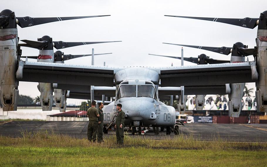 U.S. Marines with Special-Purpose Marine Air-Ground Task Force - Crisis Response - Africa conduct maintenance on MV-22B Ospreys in support of Operation United Assistance in Monrovia, Liberia, Oct. 10, 2014.