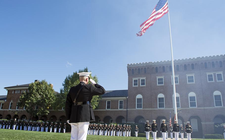 Passage of Command ceremony at the Marine Barracks in Washington, D.C., on Oct. 17, 2014. General Joseph Dunford salutes the flag and fellow Marines as cannons blasted in the distance. 