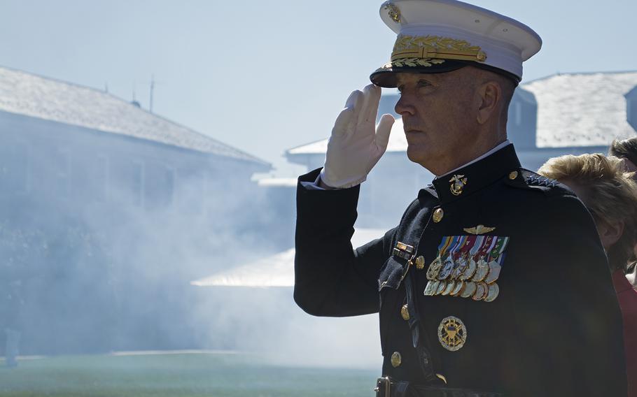 General Dunford salutes the American flag and fellow Marines during the Passage of Command ceremony in the Marine Barracks in Washington, D.C., on Oct. 17, 2014.