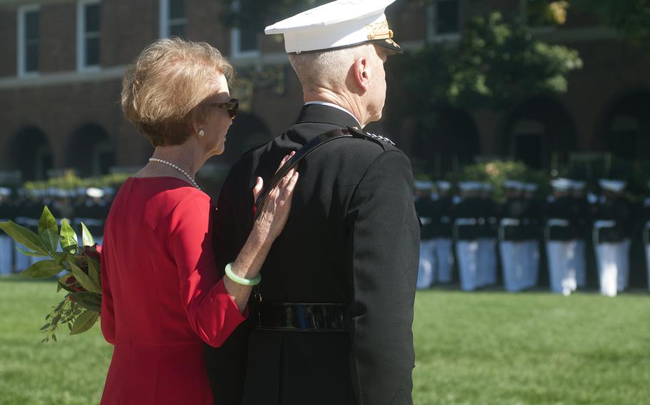General Amos and his wife are honored during the Passage of Command ceremony at the Marine Barracks in Washington, D.C., on Oct. 17, 2014.