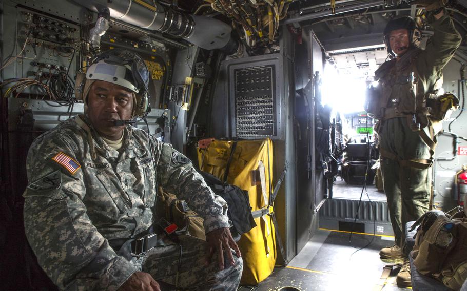 U.S. Army Maj. Gen. Darryl Williams, commander of Joint Force Command Operation United Assistance, sits inside of a U.S. Marine Corps MV-22B Osprey before taking off to conduct an aerial reconnaissance of the area in support of Operation United Assistance in Monrovia, Liberia, Oct. 11, 2014. Williams is among soldiers ordered into medical isolation upon returning from the mission to combat an Ebola outbreak in Africa.