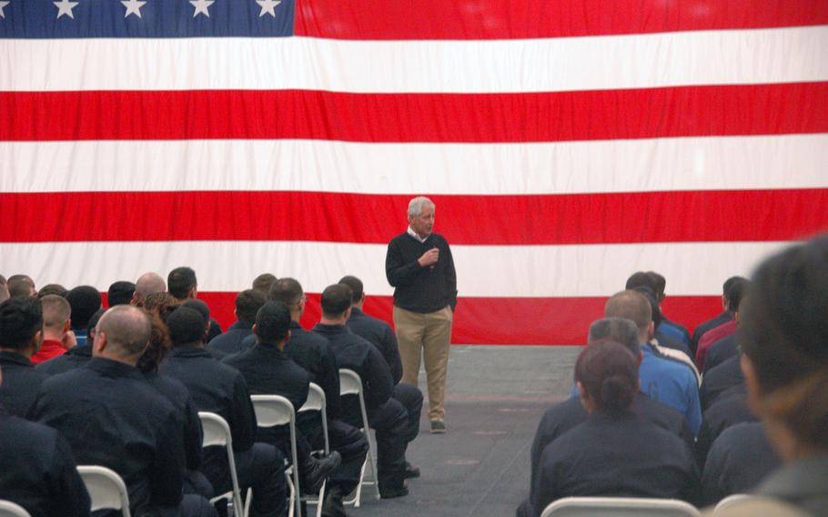 Secretary of Defense Chuck Hagel speaks to troops aboard the USS America off the coast of California.