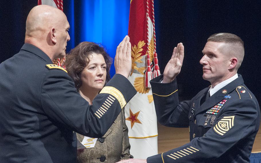 Daniel Dailey is sworn in as the 15th Sergeant Major of the Army during a swearing-in ceremony at the Pentagon in Arlington, Va., on Jan. 30, 2015. Administering the oath is Gen. Ray Odierno, chief of staff of the Army, as Dailey's wife, Holly, looks on.