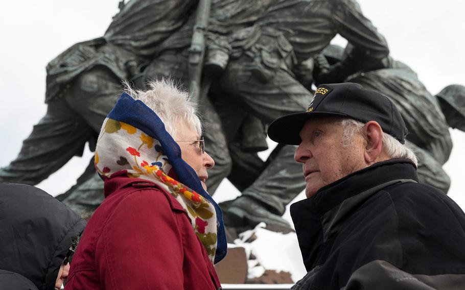 A Battle of Iwo Jima veteran and his wife speak with each other after the Iwo Jima Wreath Laying Ceremony at the Marine Corps War Memorial in Arlington, Va. on Feb. 19, 2015. The wreath laying recognized the 70th anniversary of the battle and the veterans' sacrifice.