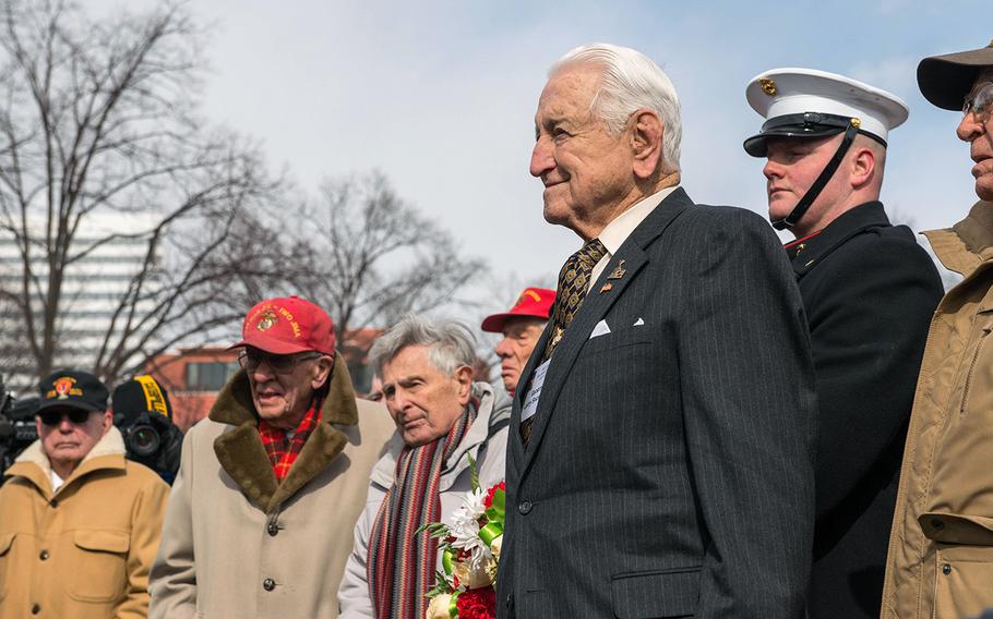Retired Lt. Gen. Lawrence F. Snowden, a 93-year-old Iwo Jima veteran, pays tribute during the Iwo Jima wreath-laying ceremony Thursday, Feb. 19, 2015, at the Marine Corps War Memorial in Arlington, Va. Snowden was a 23-year-old captain during the battle.