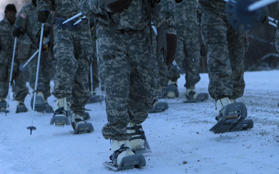 In this file photo from Nov. 2, 2012, soldiers march to the start line for a snow-shoe race at Fort Wainwright, Alaska.