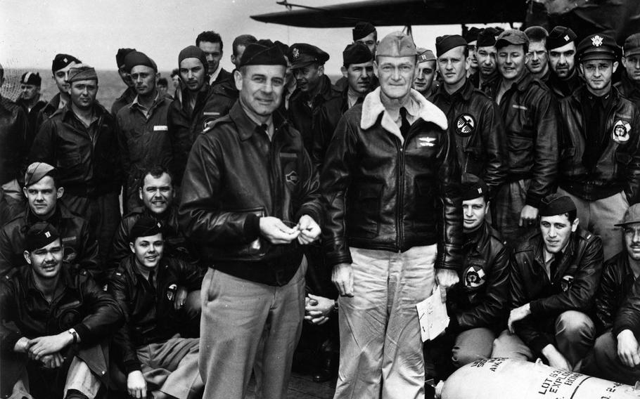 Lt. Col. James Doolittle, left, accepts a medal from the skipper of the USS Hornet, Capt. Marc A. Mitscher. The medal, once given to a U.S. Navy officer by the Japanese, was wired to a 500-pound bomb dropped during the April 18, 1942, bombing of the Japanese mainland. 
