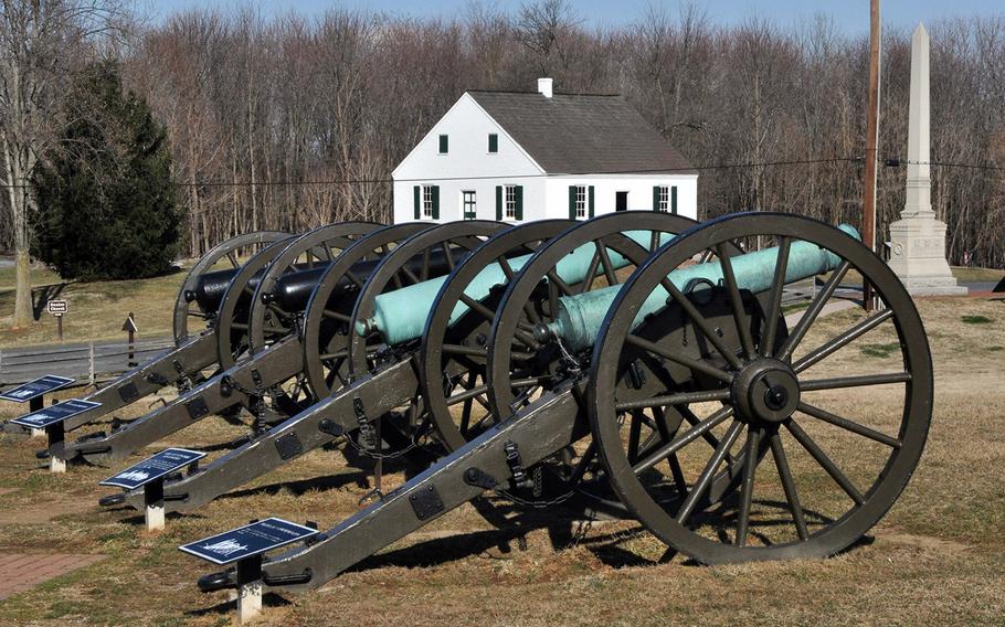 Civil War cannon stand in front of the Dunker Church at the Battle of Antietam. The church was the focus of Union attacks on Confederate lines that began the bloodiest one-day battle in American history. 