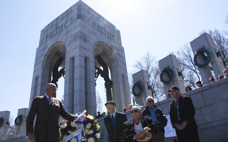 Josiah Bunting III, chairman of the Friends of the National WWII Memorial, honors veterans who fought in the Battle of Okinawa on April 1, 2015. The veterans laid a wreath at the memorial to commemorate the 70th anniversary of the battle. 