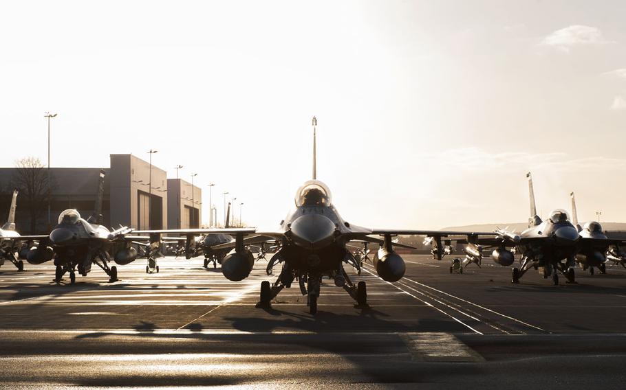 U.S. Air Force F-16 Fighting Falcon fighter aircraft assigned to Spangdahlem Air Base, Germany, sit on the flight line of Ramstein Air Base, Germany, April 1, 2015.