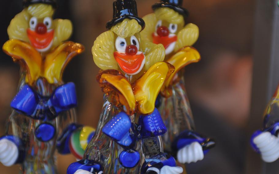 A few glass clowns sit in a shop on Murano, Italy, in Venice, Italy. Just about anything that can be made of glass is for sale at the dozens of shops on the island.

