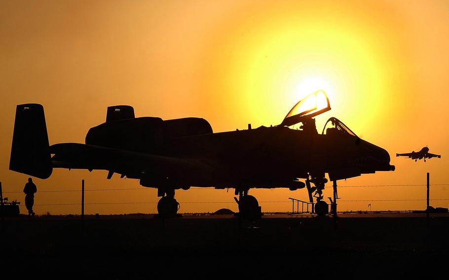 Maintenance crews on the A-10 Warthog end their 12-hour duty day at the Al Asad Air Base in Iraq in 2004.