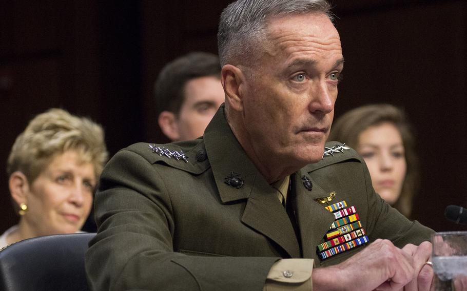 Gen. Joseph F. Dunford, Jr. listens to opening statements during a Senate Armed Services Committee hearing on his nomination as chairman of the Joint Chiefs of Staff on Capitol Hill, July 9, 2015. Behind him are his wife, Ellyn, son Patrick and niece, Jenna Sartucci.