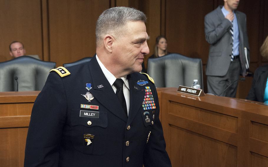 Gen. Mark Milley greets members of the Senate Armed Services Committee on Tuesday, July 21, 2015, as committee members considered Milley's nomination to be the next Army chief of staff.