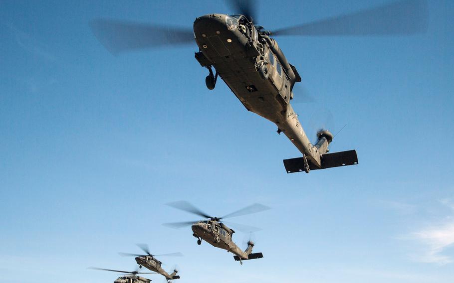 UH-60 Black Hawks fly in formation over Fort Irwin, Calif., in May 2014.