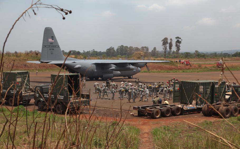 U.S. Army Soldiers from many different units in support of combined joint training exercise Central Accord 2014 (CA 14), prepare for airborne operations alongside Cameroon Army paratroopers in Cameroon, Africa, March 15, 2014. CA 14 is being conducted in order to sustain tactical proficiency, improve multi-echelon operations, and develop multi-national logistical capabilities in an austere forward environment. 