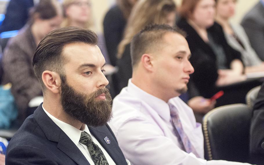 Marine veteran Nicholas Karnaze, left, and Navy veteran Dean Maiers listen to a question as they attend a  Senate Committee on Veterans Affairs hearing on Capitol Hill in Washington, D.C., on Wednesday, Oct. 28, 2015.