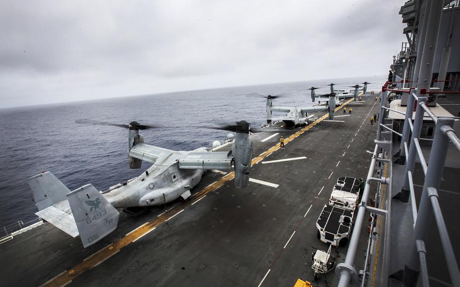 MV-22B Ospreys cover and align on the flight deck of the USS Essex during Composite Training Unit Exercise March 18, 2015.
