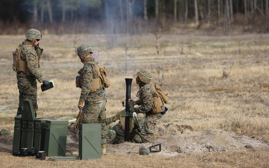 U.S. Marines with 2nd Battalion, 2nd Marine Regiment,  launch  a round during a live-fire mortar exercise with 81 mm mortar systems in preparation for the unit's upcoming deployment at Camp Lejeune, N.C., Jan. 21, 2016. 