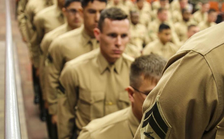 U.S. Marines with Marine Aircraft Group 39  Corporals Course 341-16 stand in line to receive their certificates during their graduation at Marine Corps Base Camp Pendleton, Calif., Jan. 27, 2016. Eighty-one Marines graduated from the three-week training course required for corporals to earn the next rank.