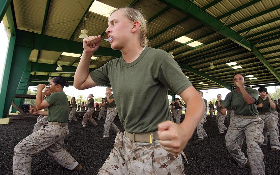 Female Marine recruits practice rear hand punches during training at Parris Island, S.C., in July 2011.
