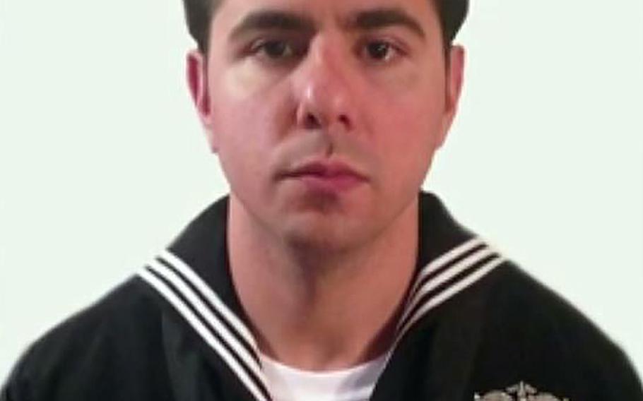 A video screen grab shows Petty Officer 2nd Class Alejandro N. Salabarria.
