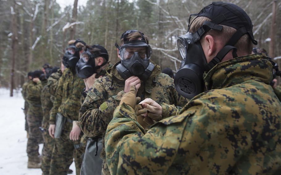 U.S. Marines assigned to the 22nd Marine Expeditionary Unit practice clearing their M50 Joint Service General Purpose Masks before entering the gas chamber during a training exercise at Fort Pickett, Va., Feb. 15, 2016. 